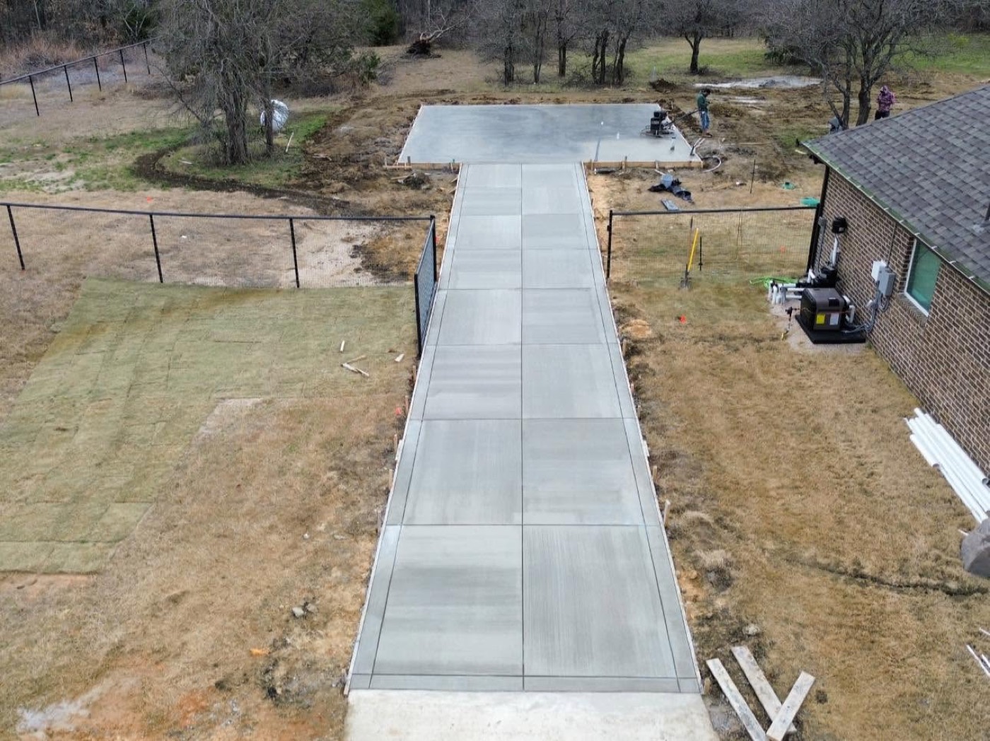 Newly poured concrete driveway leading to a home in Rockwall County, Texas