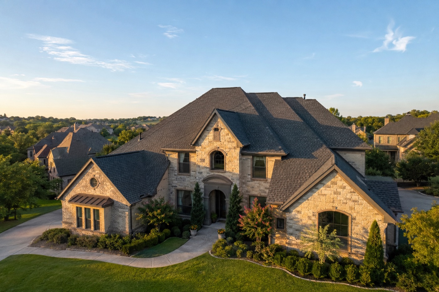 Newly replaced asphalt shingle roof on a two-story home in Rockwall County, Texas